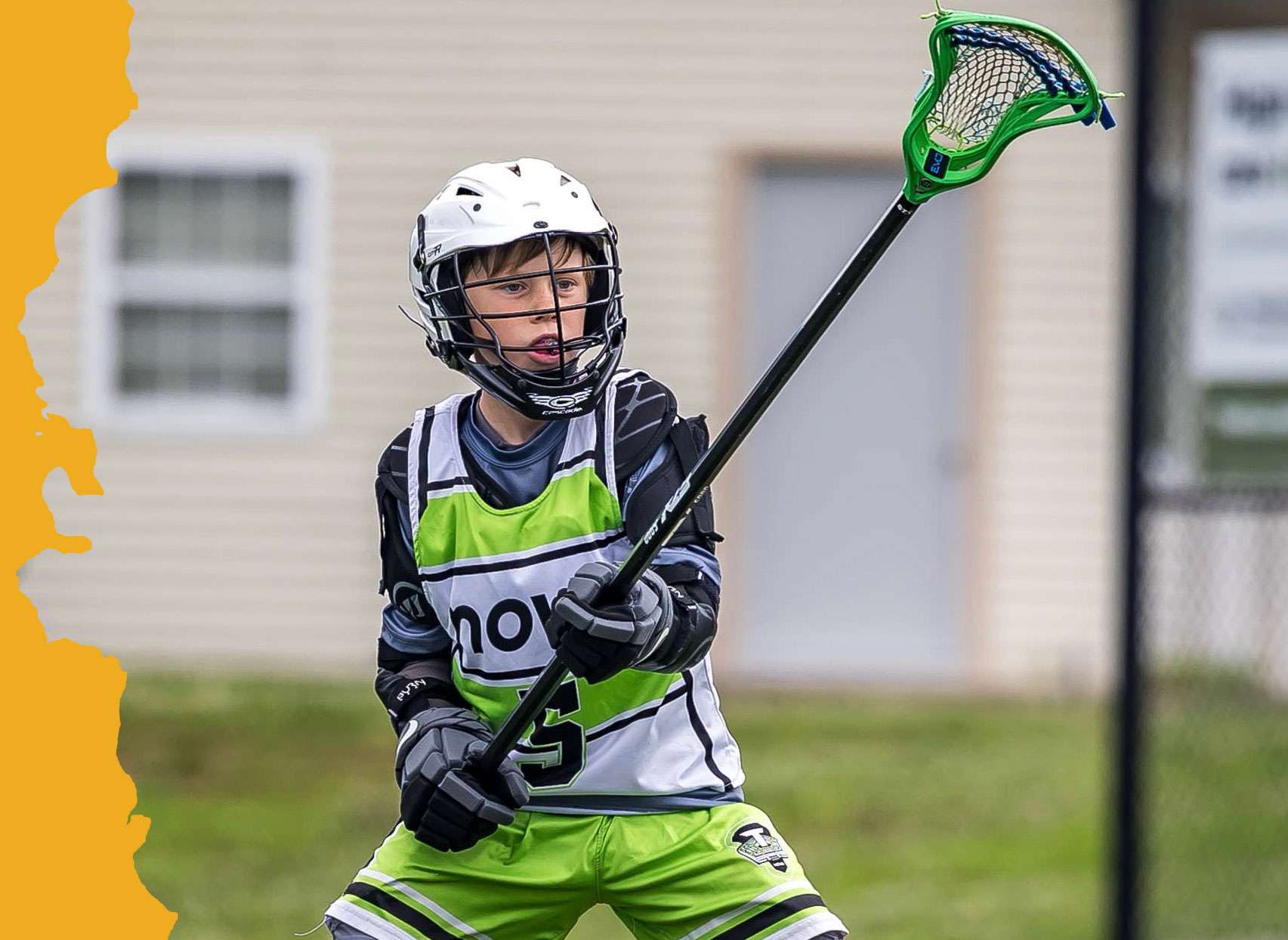 image of young man playing lacrosse